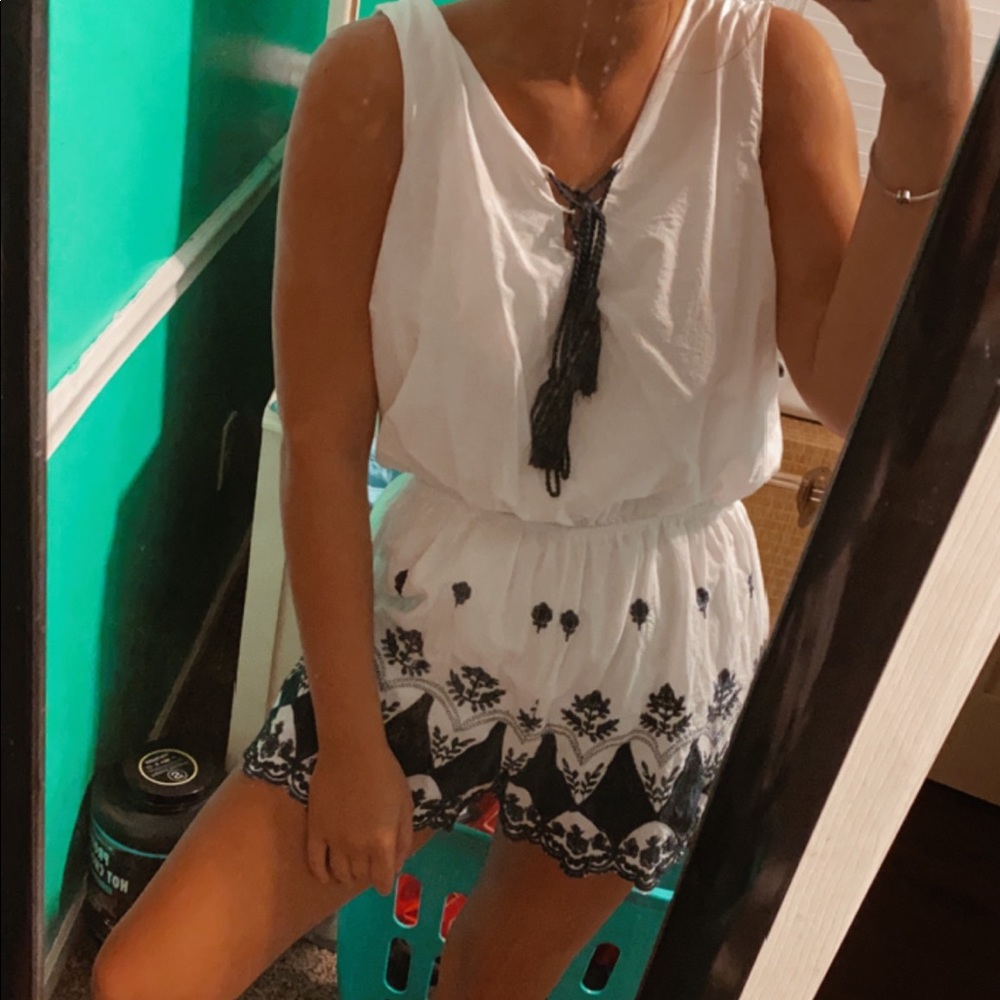 White floral romper navy blue detail